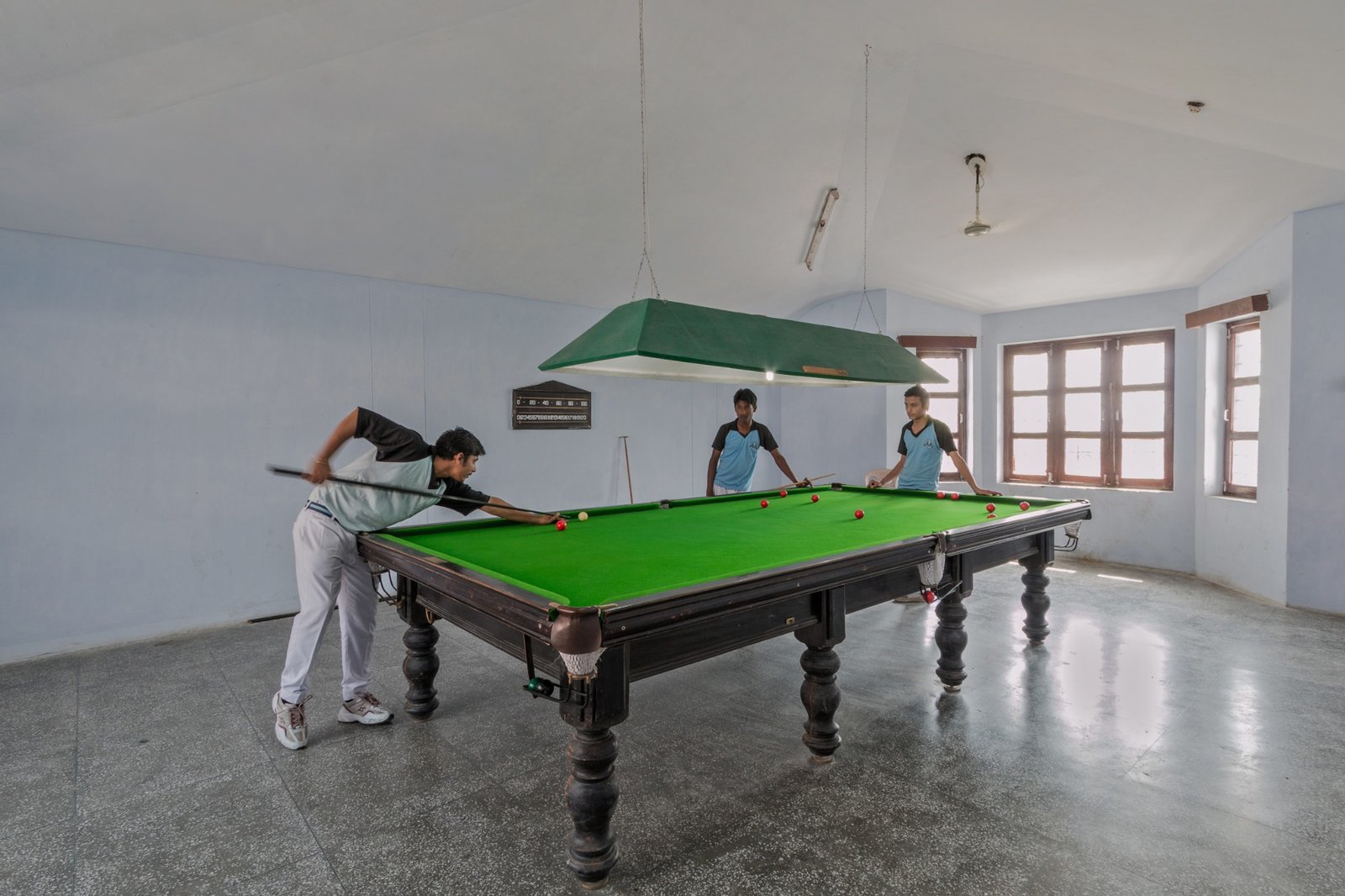 Students playing billiards