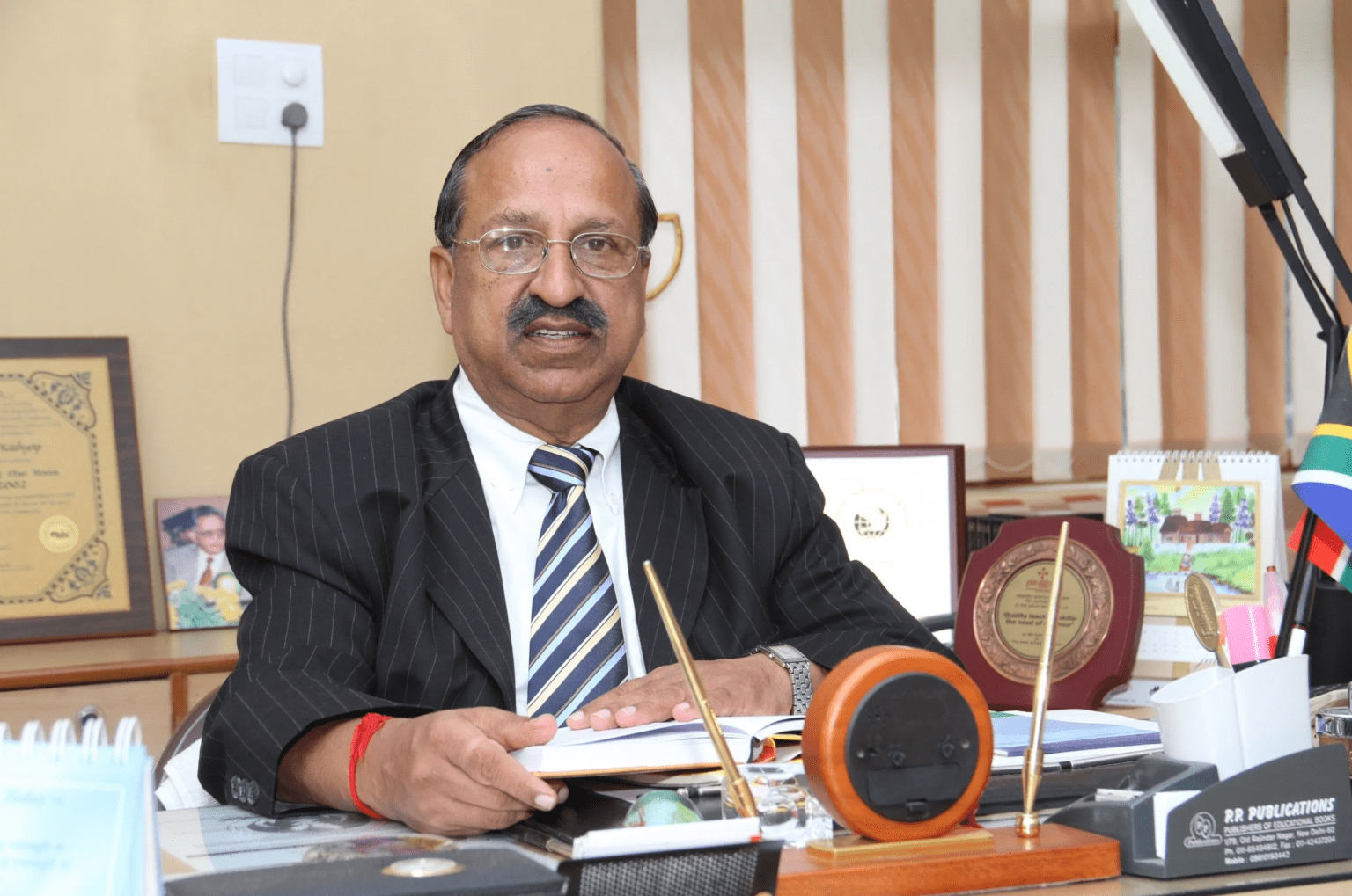 Dr. Prem Kashyap seated in his office